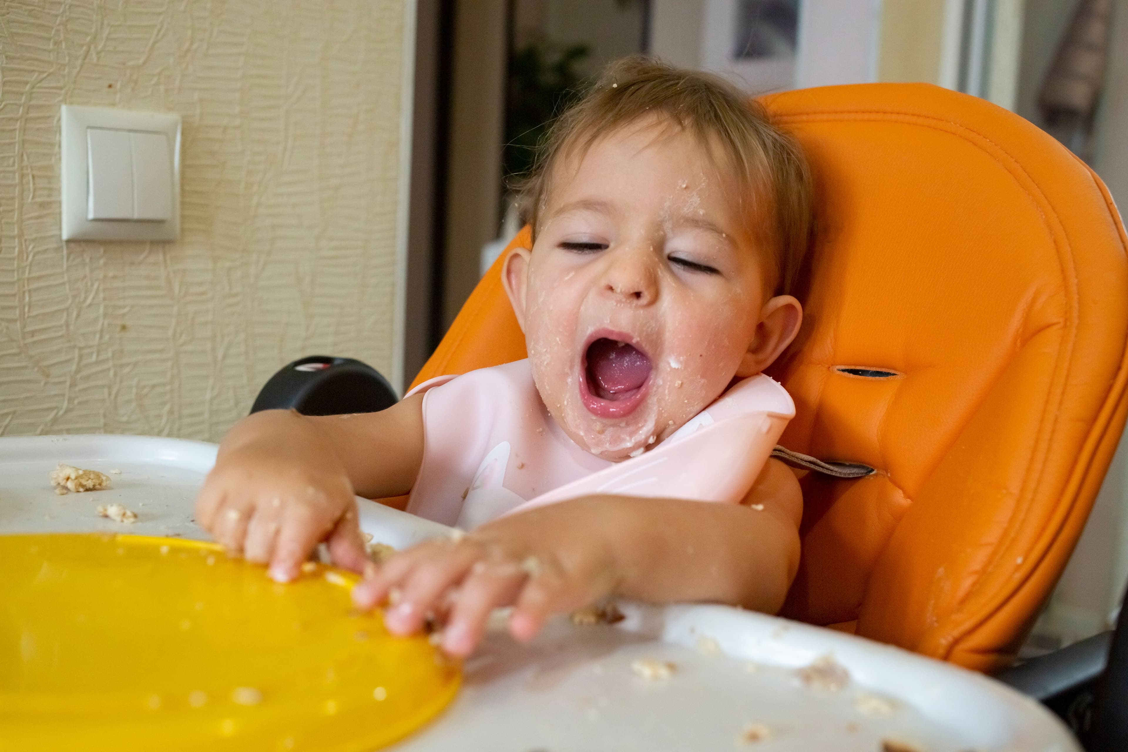 How can you encourage your baby to eat solid food?